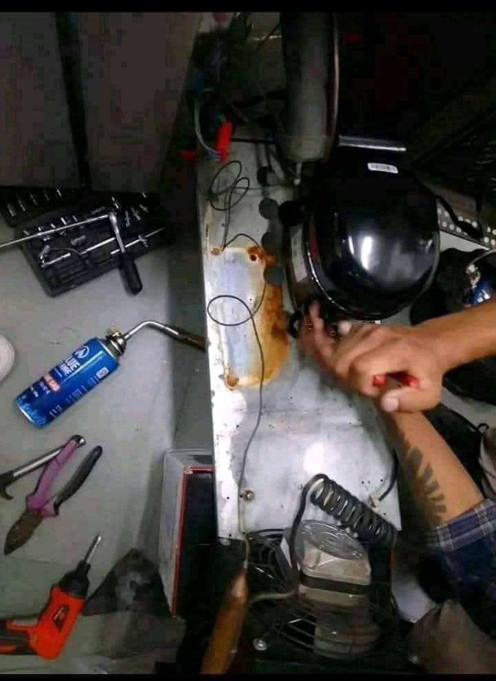 Hands-on compressor repair work by FouRie
